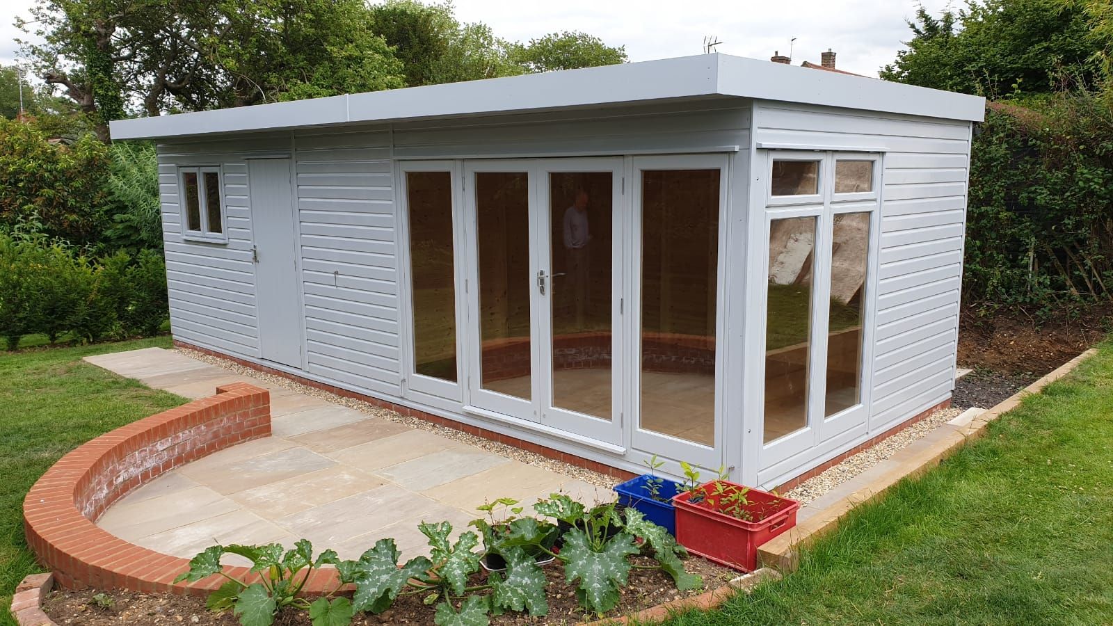 A garden gym building with workout equipment inside