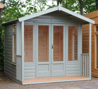 Newmarket Summerhouse 8ft x 6ft (2.4m x 1.8m) with a 2ft (0.6m) veranda & slatted timber floor, in a coloured stain finish
